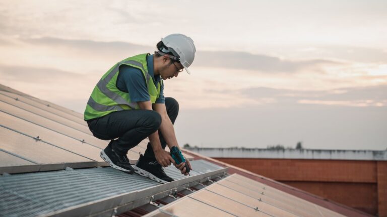 Contractor working on a roof, the kind of real job photo contractor websites should use